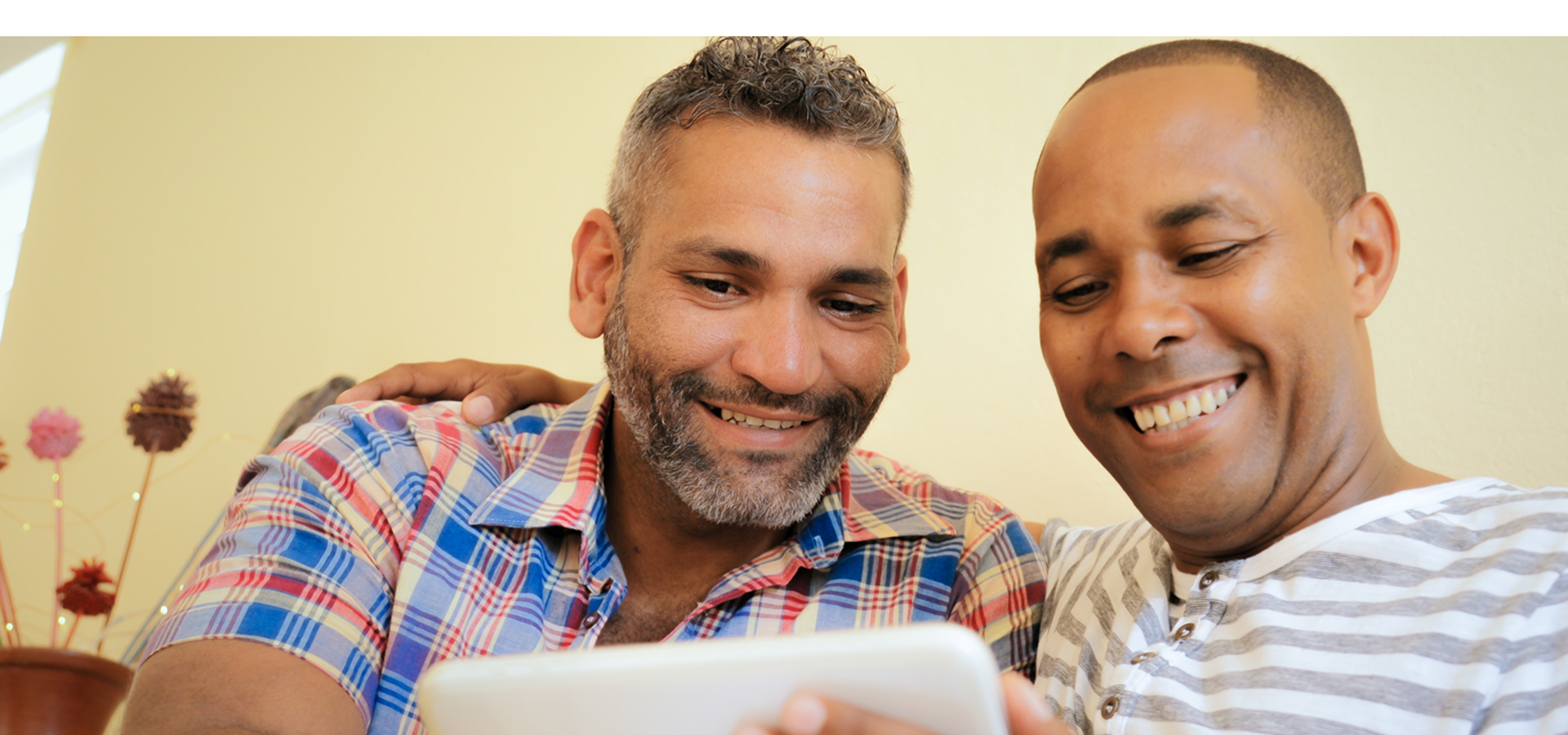 Couple looking at cell phone.